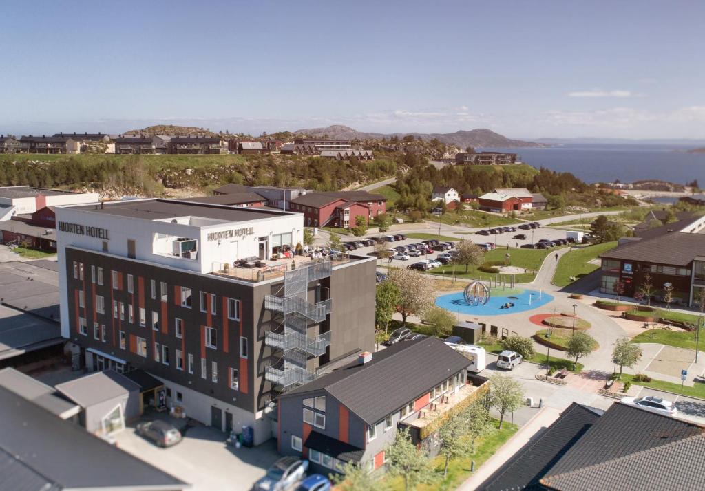 an aerial view of a town with a resort at Hjorten Hotell Hitra in Fillan