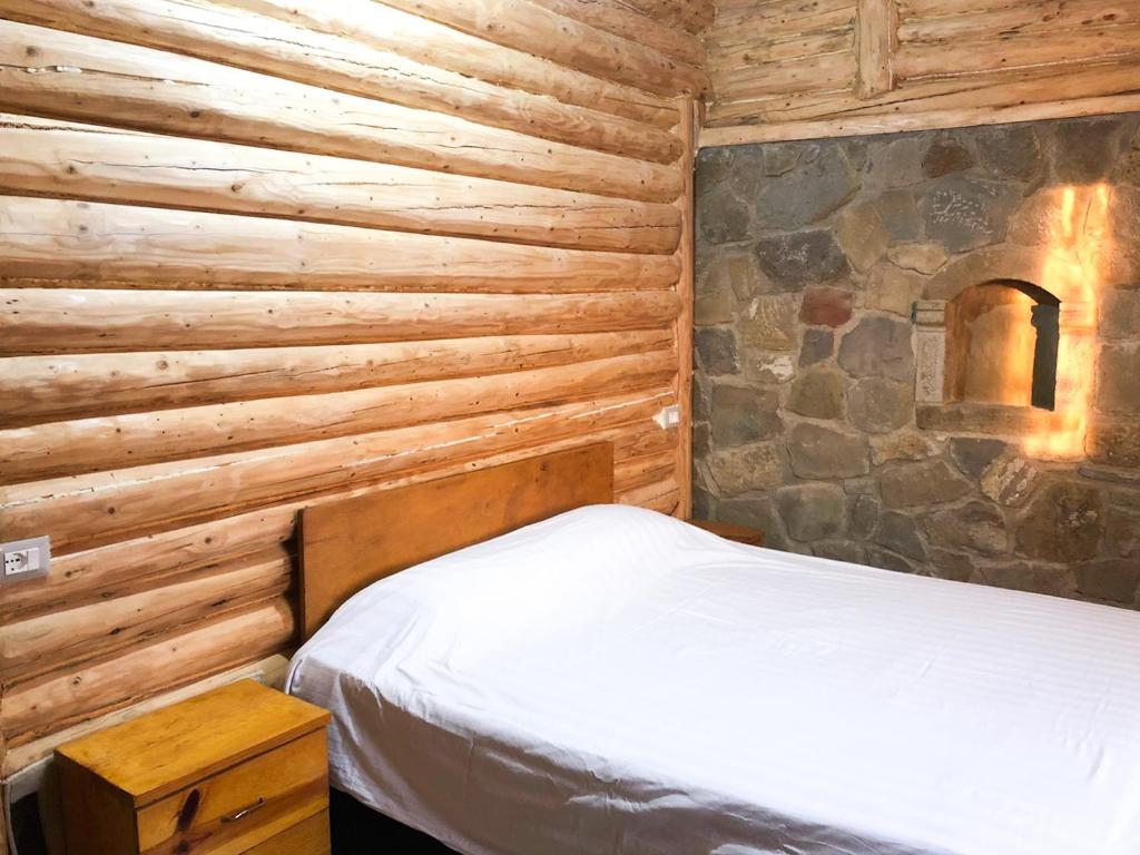 Postel nebo postele na pokoji v ubytování Lodges VEIS