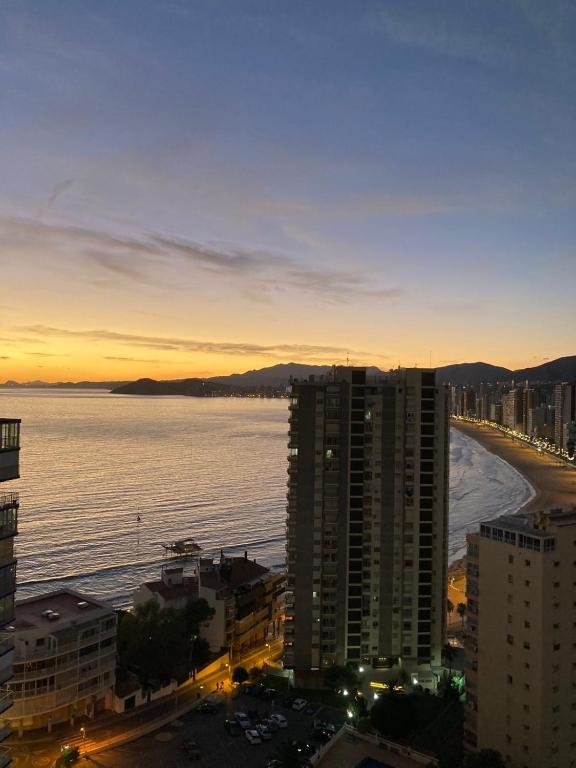 a view of a city with the ocean and buildings at VERANO AZUL in Benidorm