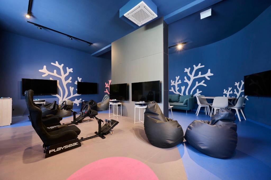 Televízia a/alebo spoločenská miestnosť v ubytovaní Hotel Umag Plava Laguna