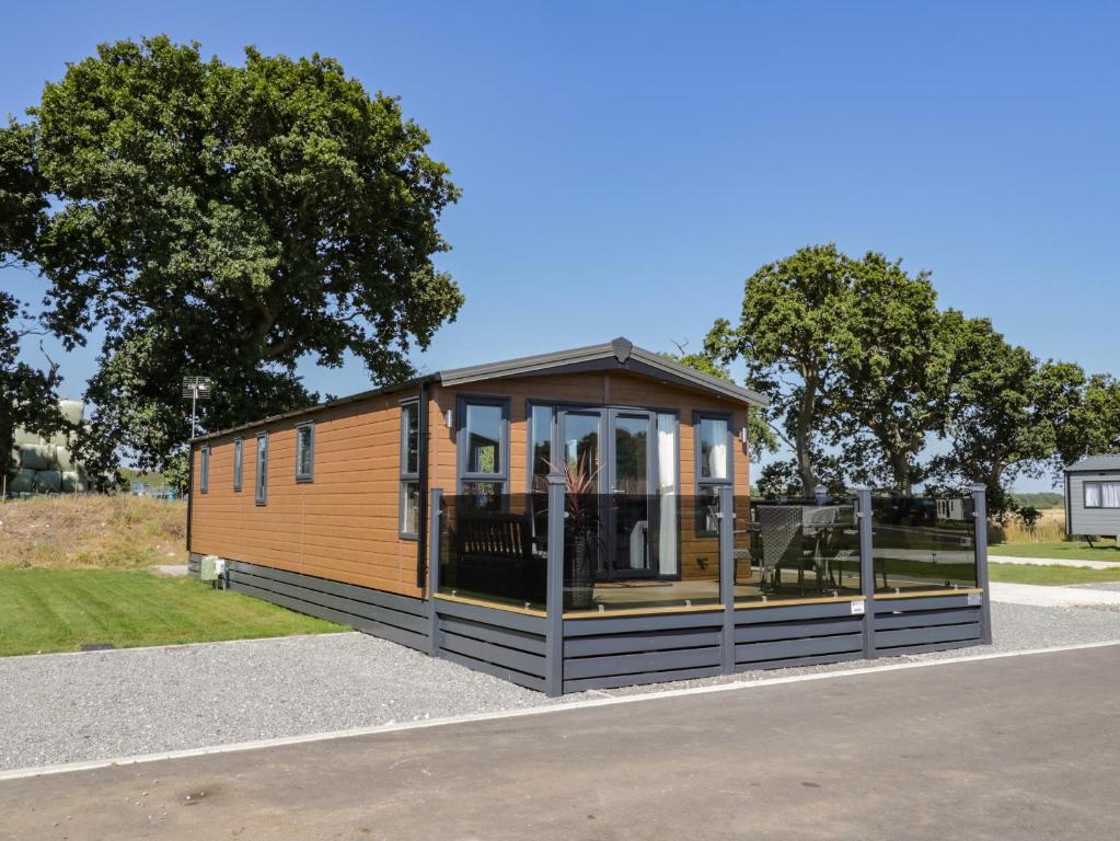 a tiny house sitting on the side of a road at Away Daze in Bridlington