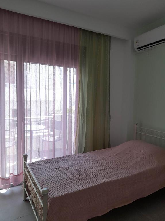 Ένα ή περισσότερα κρεβάτια σε δωμάτιο στο Cosy