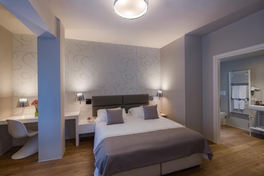 Postel nebo postele na pokoji v ubytování Hotel Monte Meraviglia