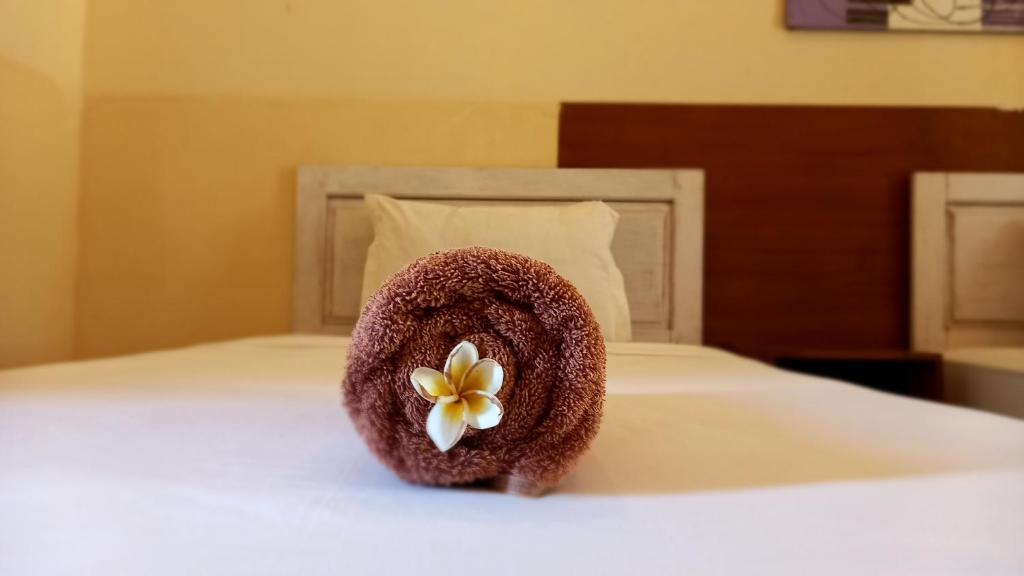 Postel nebo postele na pokoji v ubytování Wisma Bunda