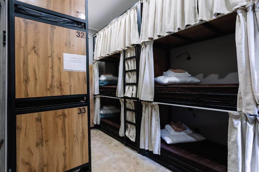 a group of bunk beds in a room at DOMA HOSTEL in Almaty
