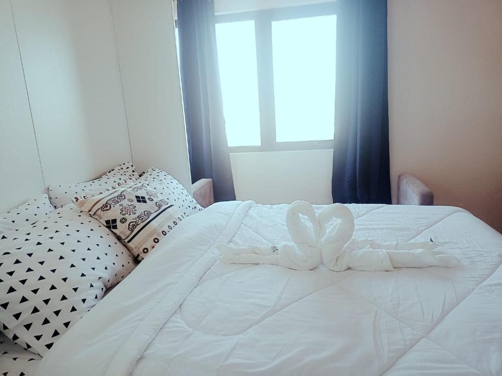 Säng eller sängar i ett rum på The persimmon condo