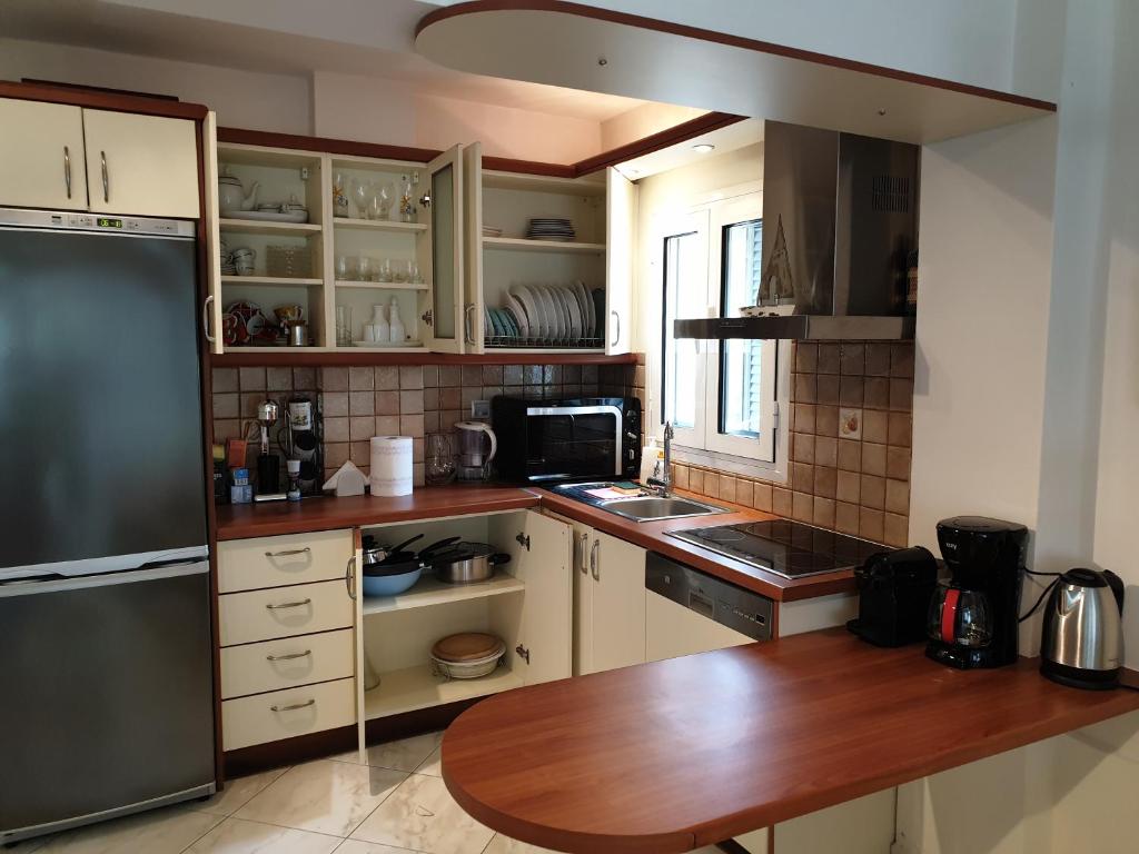 Kuchyň nebo kuchyňský kout v ubytování HOUSE SUITES DOMAINE