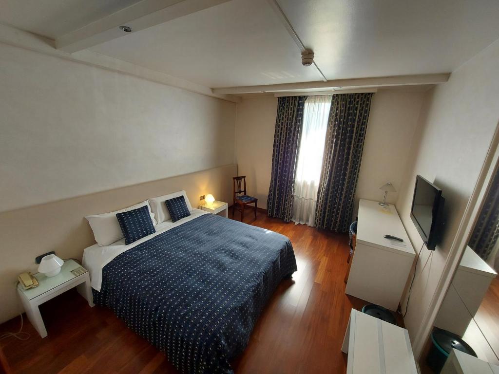 Postel nebo postele na pokoji v ubytování Hotel Posta 77