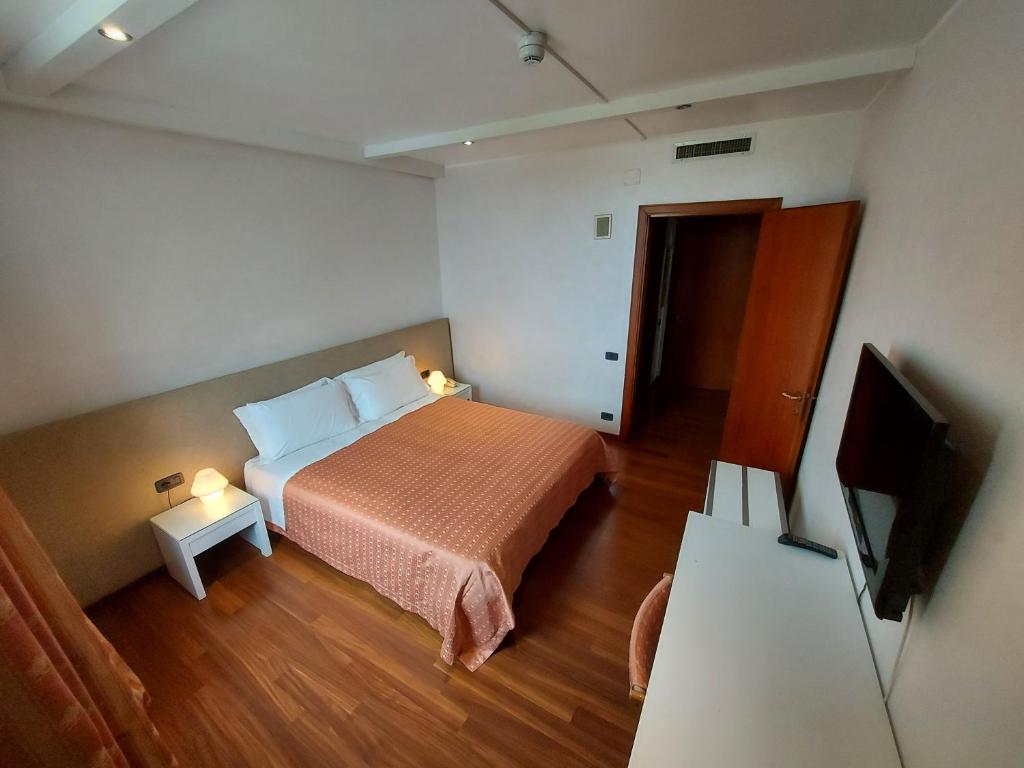 Postel nebo postele na pokoji v ubytování Hotel Posta 77
