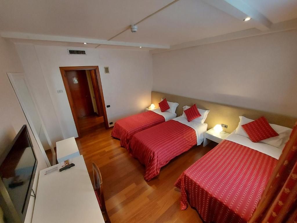 Postel nebo postele na pokoji v ubytování Hotel Posta 77