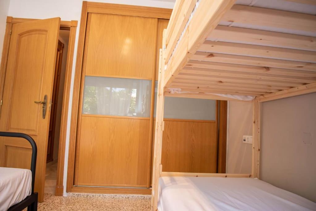 Posteľ alebo postele v izbe v ubytovaní Piso con Jardín