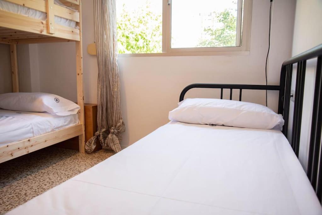 Posteľ alebo postele v izbe v ubytovaní Piso con Jardín