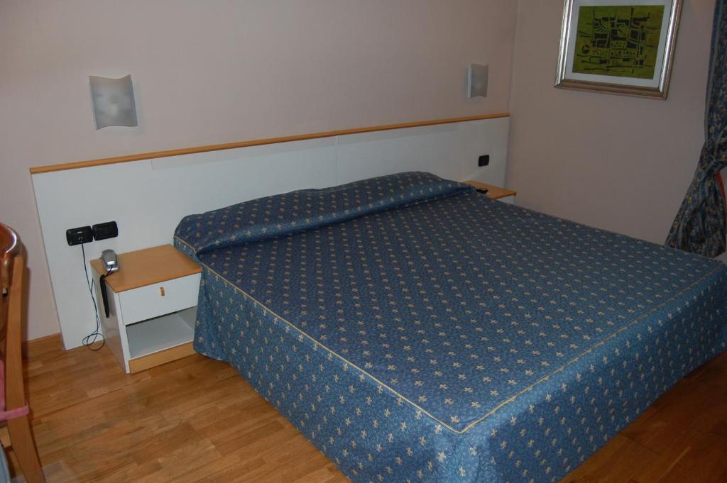 Postel nebo postele na pokoji v ubytování Albergo Ristorante Sant'Eustorgio