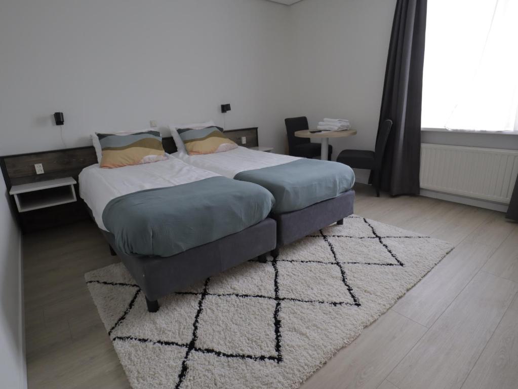 Postel nebo postele na pokoji v ubytování Hotel Zuideinde