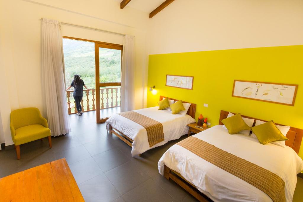 Postel nebo postele na pokoji v ubytování Gocta Andes Lodge
