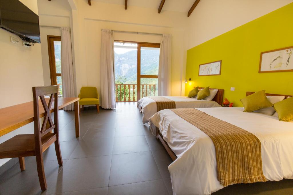Postel nebo postele na pokoji v ubytování Gocta Andes Lodge