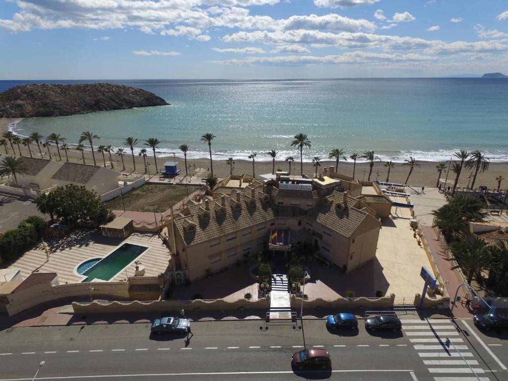 an aerial view of a building next to the beach at Hotel Playa Grande in Puerto de Mazarrón