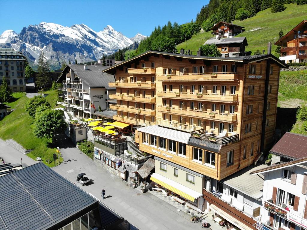 an overhead view of a building in a city with mountains at Eiger Mürren Swiss Quality Hotel in Mürren