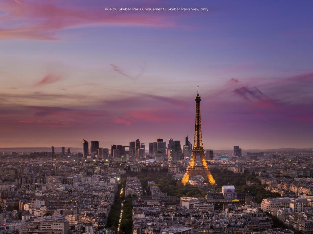 a view of the eiffel tower at dusk at Pullman Paris Montparnasse in Paris
