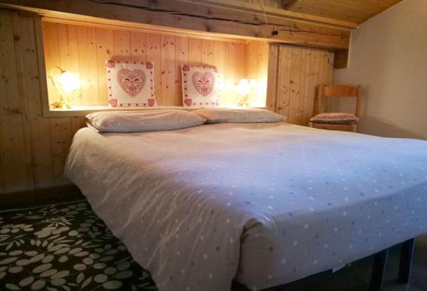 En eller flere senge i et værelse på B&B Sòl Fiorì