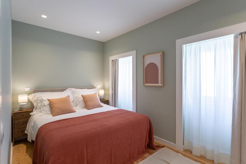 Llit o llits en una habitació de Ajuda Luxury Appartments