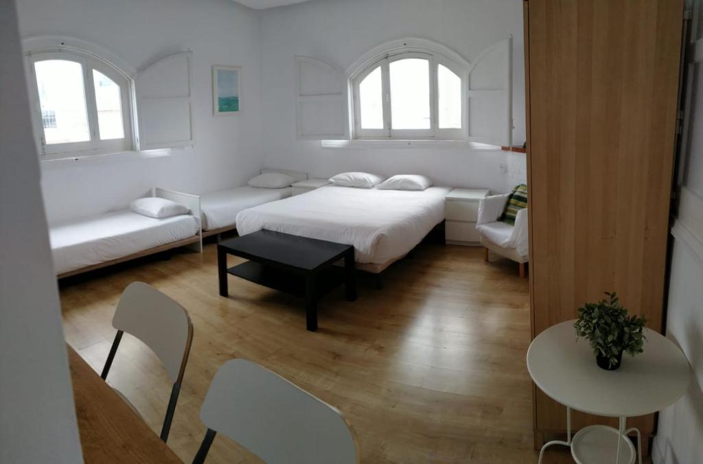 Postel nebo postele na pokoji v ubytování Torreon Sol Apartment