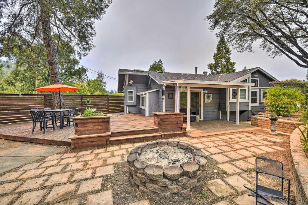 a home with a patio with a fire pit at Pet-Friendly House with Deck Less Than 3 Mi to Dtwn! in Placerville