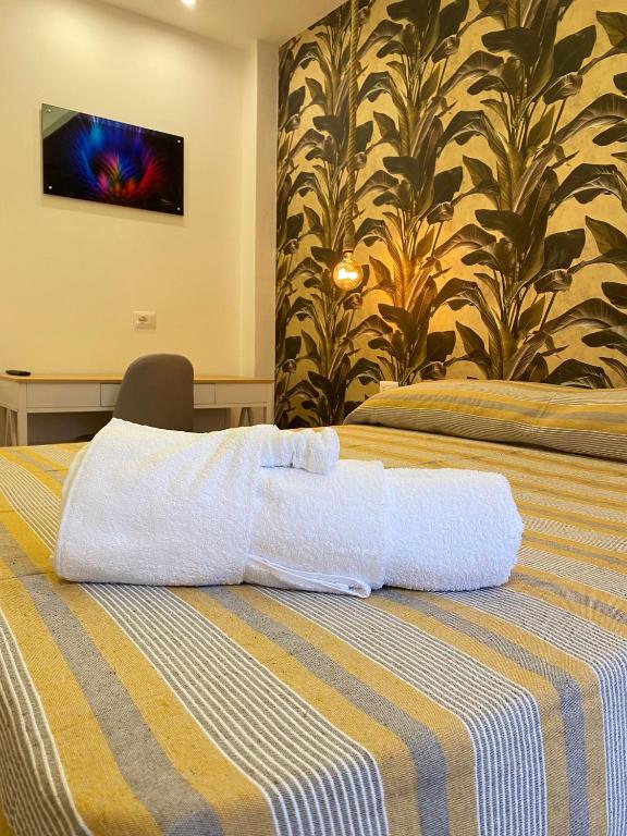 Łóżko lub łóżka w pokoju w obiekcie b&b Stadium room & suite