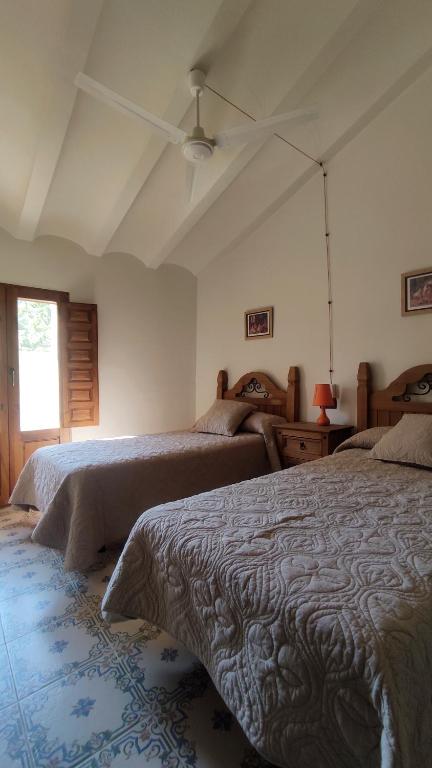 Postel nebo postele na pokoji v ubytování Finca La Celada