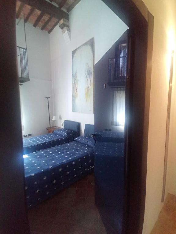 Posteľ alebo postele v izbe v ubytovaní Locanda del Glicine