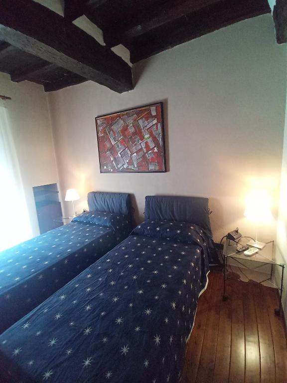 Posteľ alebo postele v izbe v ubytovaní Locanda del Glicine