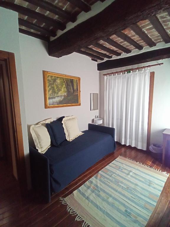 Posteľ alebo postele v izbe v ubytovaní Locanda del Glicine