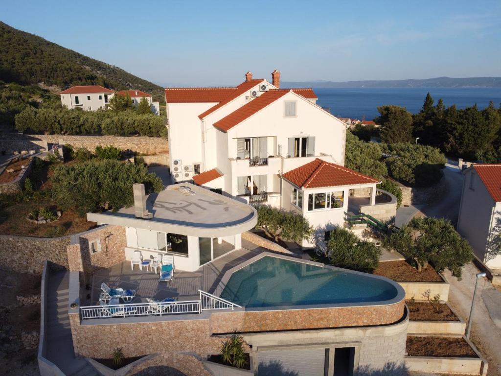 an aerial view of a house with a swimming pool at Villa Franka with swimming pool in Bol