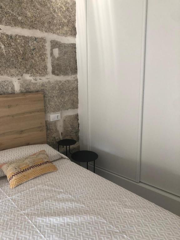 Postel nebo postele na pokoji v ubytování A esmorga