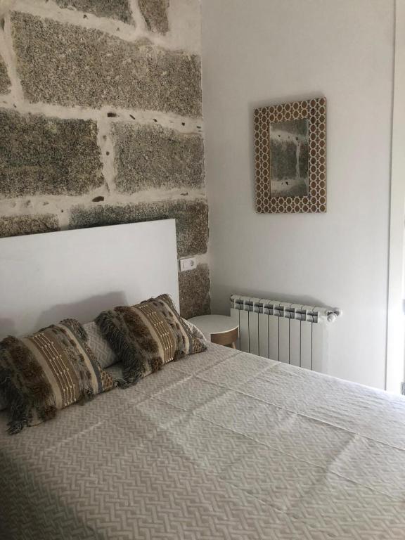 Postel nebo postele na pokoji v ubytování A esmorga