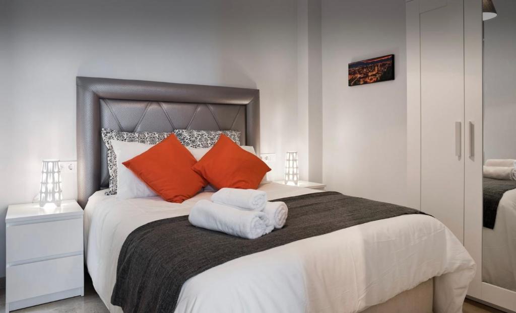 Posteľ alebo postele v izbe v ubytovaní MALAGUETA BEACH HOUSE