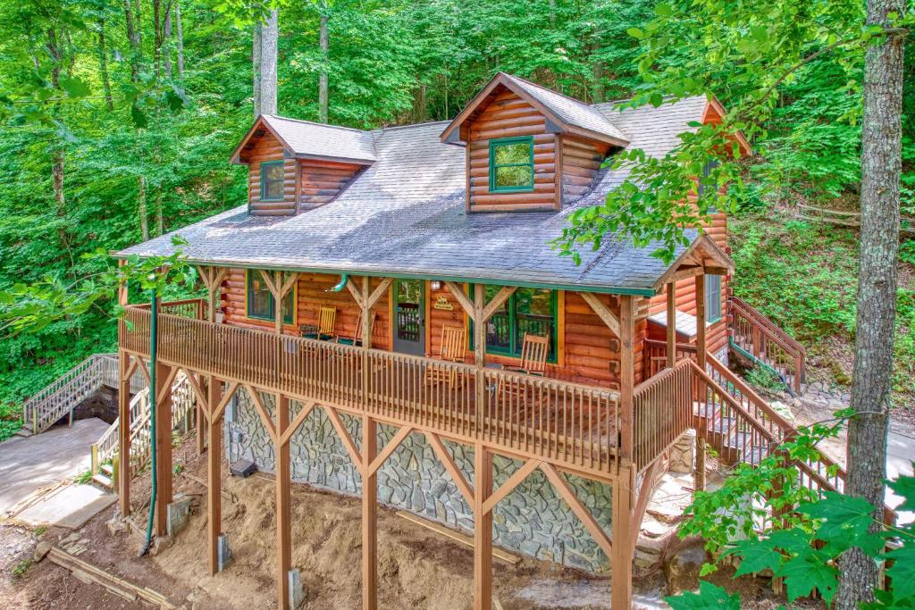 a log cabin in the middle of the woods at Forest Hideaway in Maggie Valley