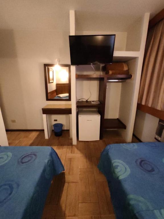 Cama ou camas em um quarto em Hotel Elo Curitiba
