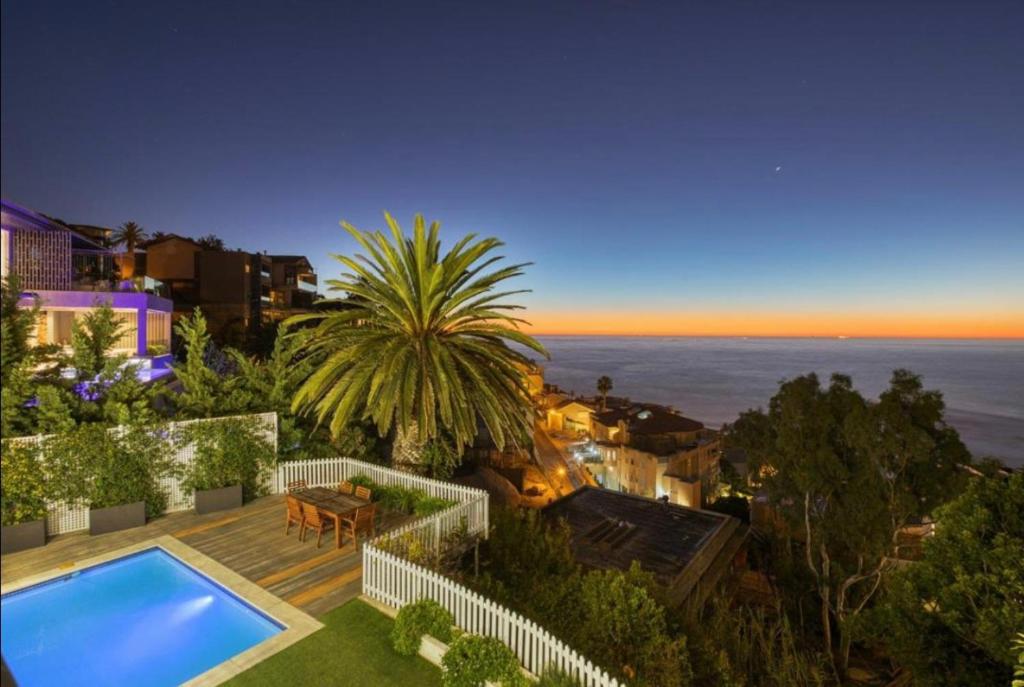 a view of a house with a swimming pool at Private Pool! Bantry Bay Large Flat with Solar in Cape Town