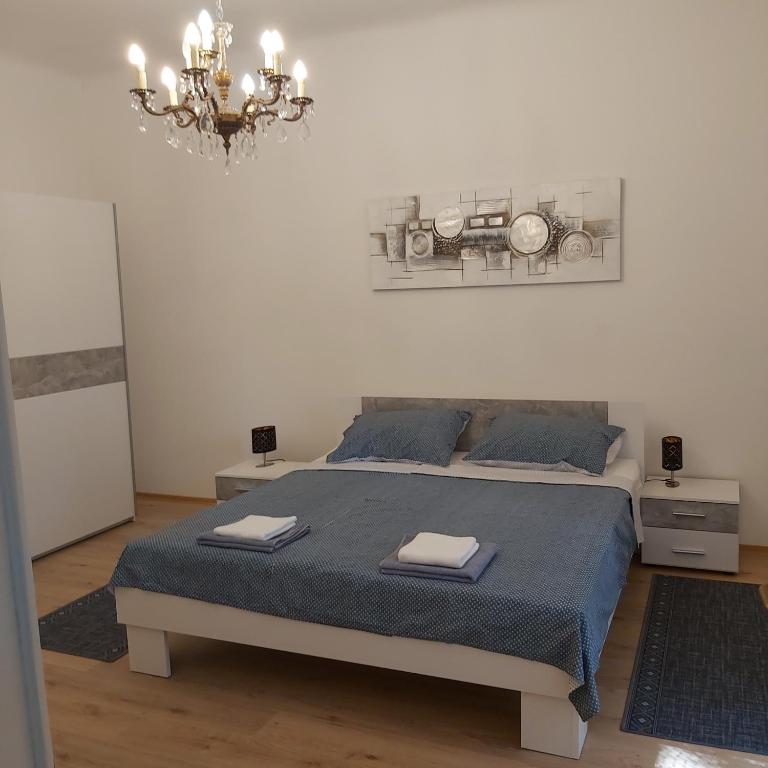 Posteľ alebo postele v izbe v ubytovaní Apartman Fiume