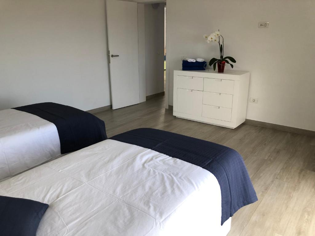 Postel nebo postele na pokoji v ubytování Vivienda vacacional Agripina
