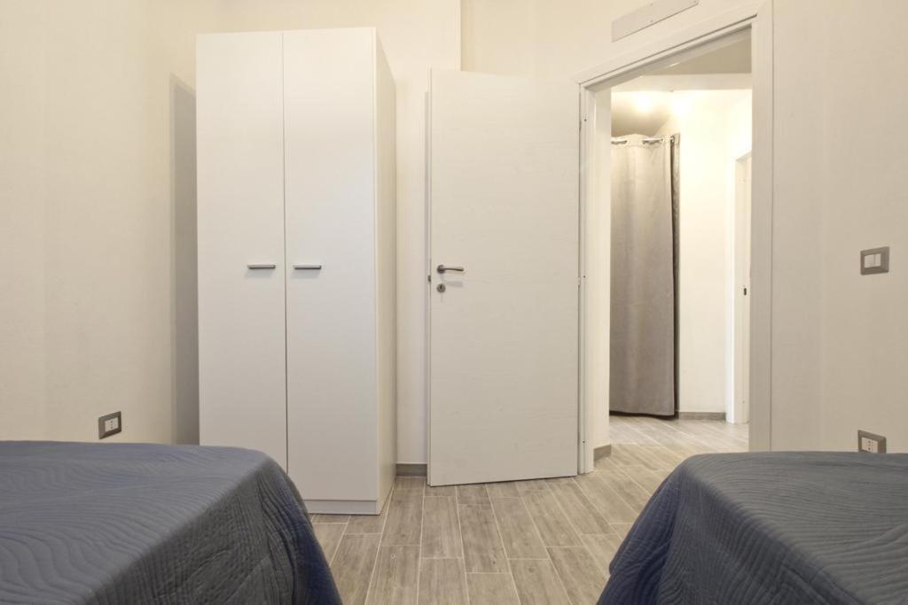Łóżko lub łóżka w pokoju w obiekcie Appartamenti Nicolò