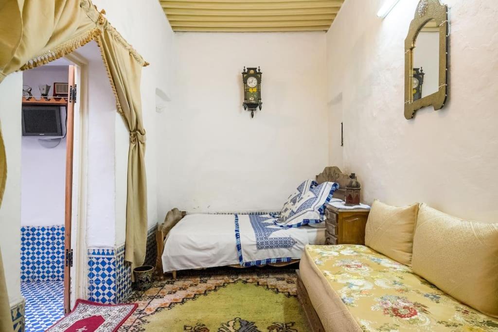 Postel nebo postele na pokoji v ubytování Dar Fatimazahra