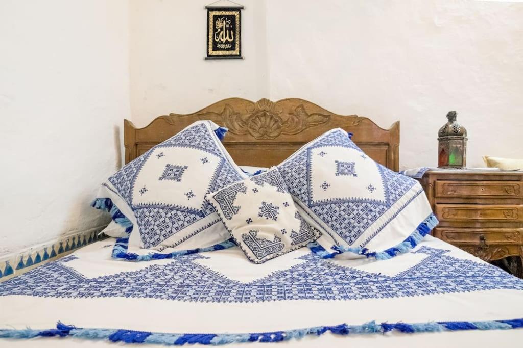 Postel nebo postele na pokoji v ubytování Dar Fatimazahra