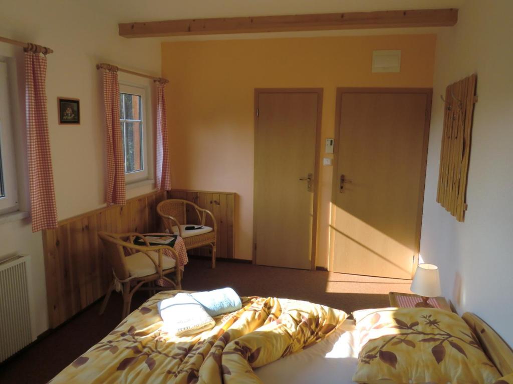 Postel nebo postele na pokoji v ubytování Pension Hela