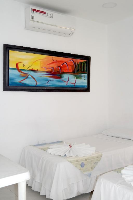 Postel nebo postele na pokoji v ubytování Comodas Habitaciones Hotel Bucaros