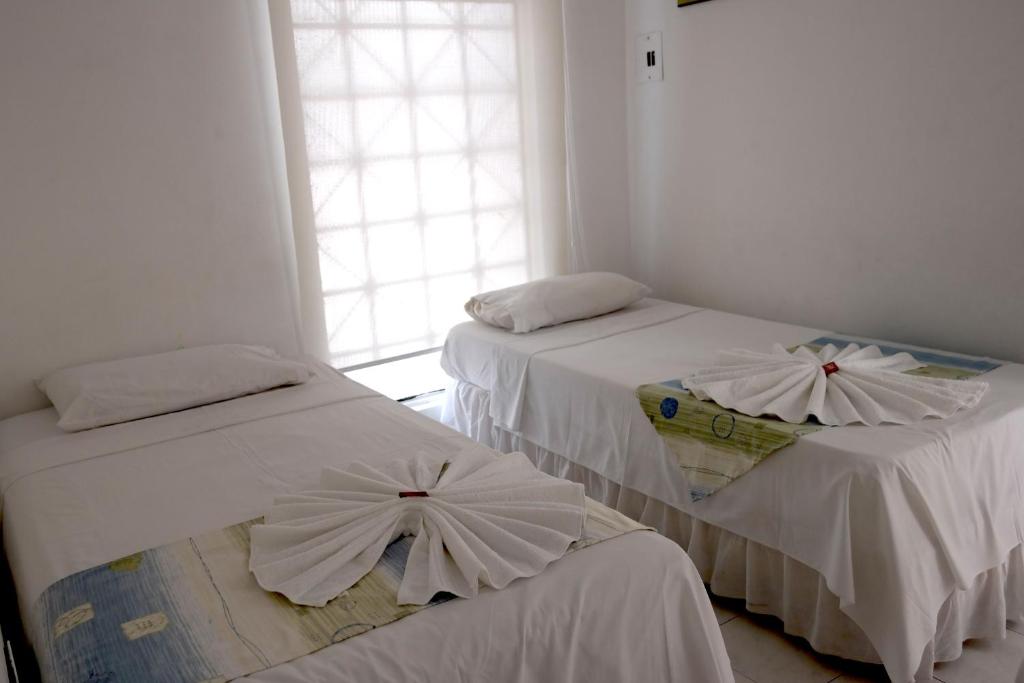 Postel nebo postele na pokoji v ubytování Comodas Habitaciones Hotel Bucaros