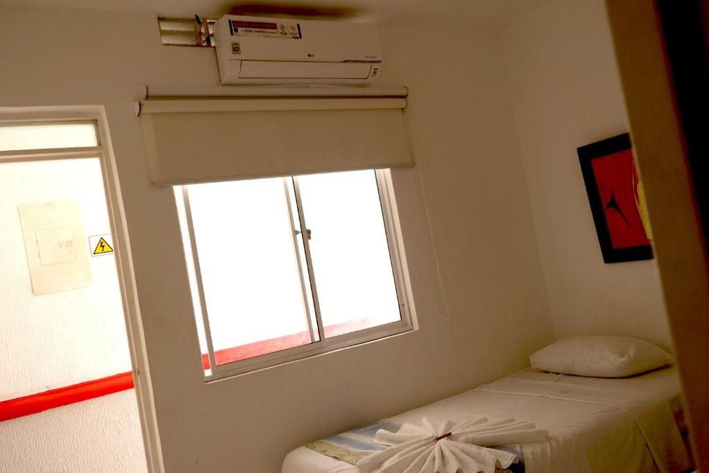 Postel nebo postele na pokoji v ubytování Comodas Habitaciones Hotel Bucaros