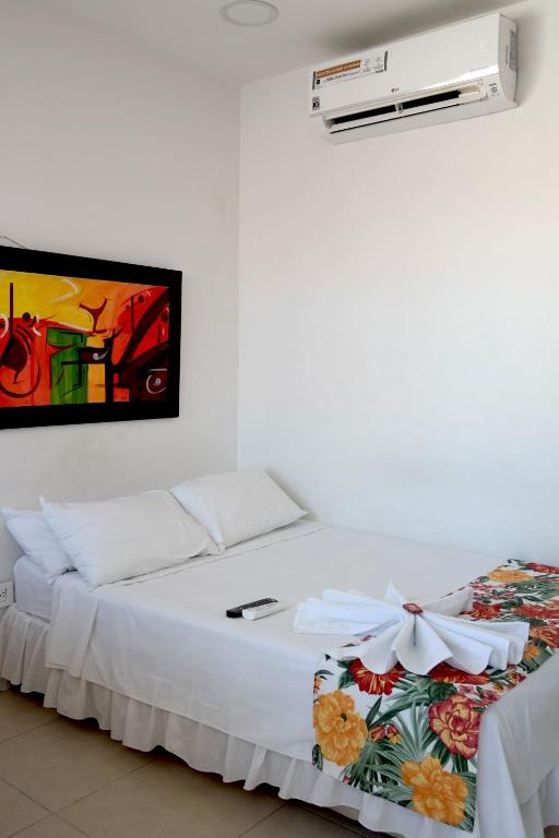 Postel nebo postele na pokoji v ubytování Comodas Habitaciones Hotel Bucaros