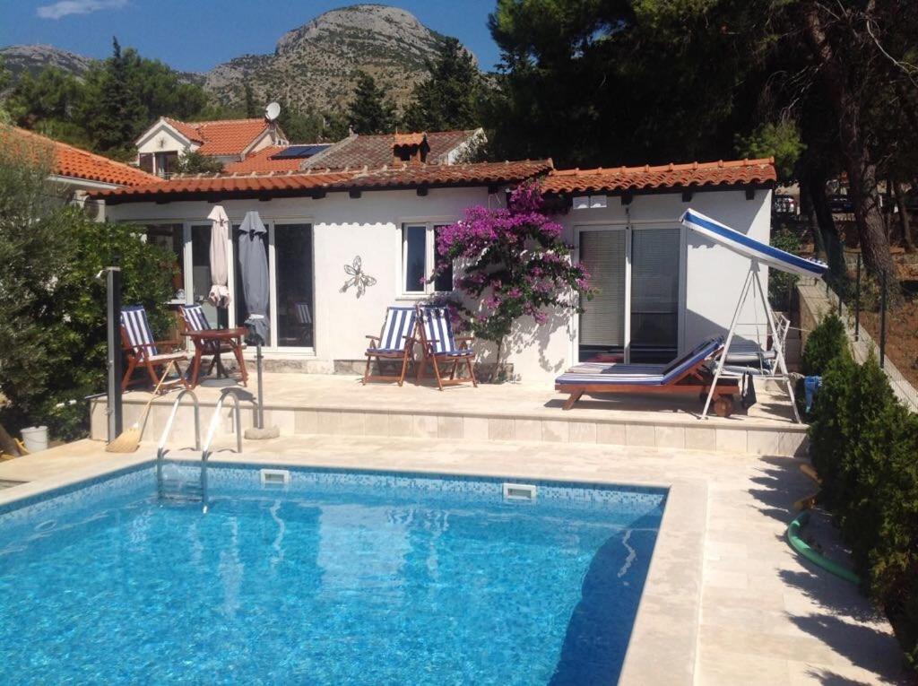 The swimming pool at or close to Family friendly apartments with a swimming pool Bol, Brac - 14379
